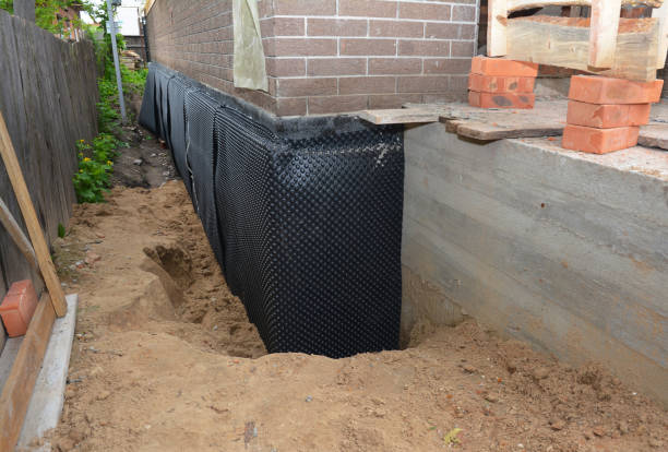 Happy homeowners after waterproofing job in Riverton